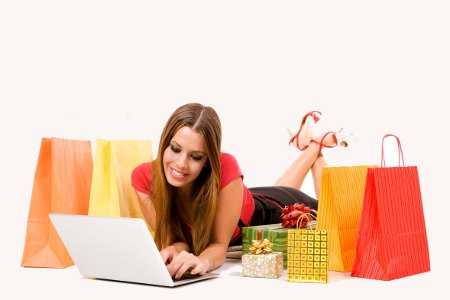 Beautiful young woman shopping over internet.